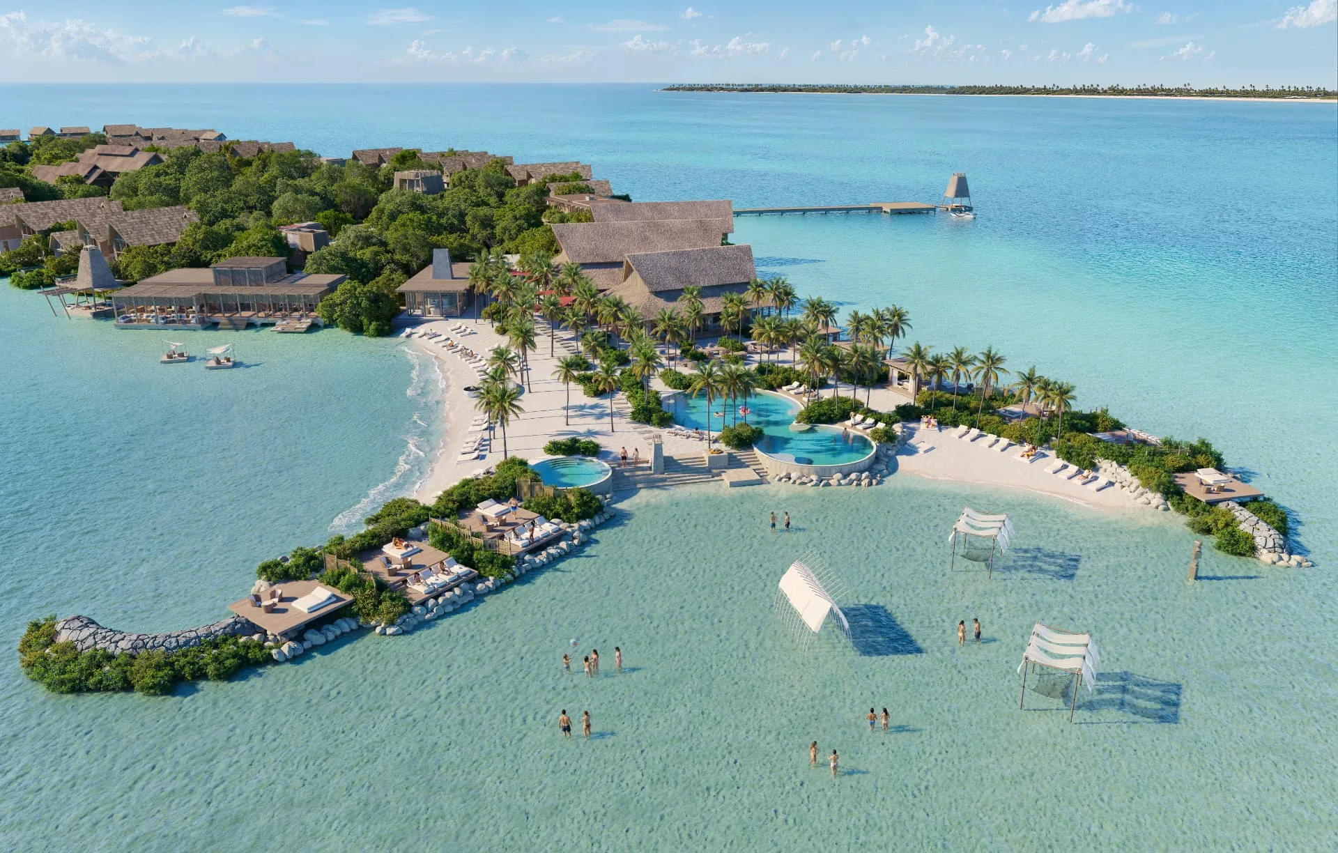 Aerial view of the beach club, pools and shoreline